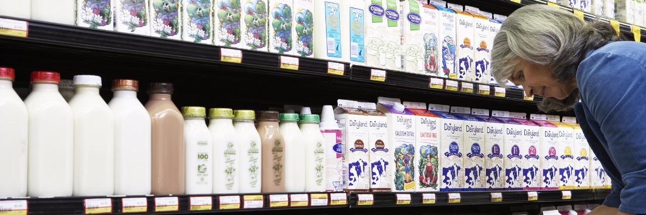 To the Albertsons Employees Who Saw Me Having a Panic Attack Mature woman reading milk label in supermarket, side view, close-up