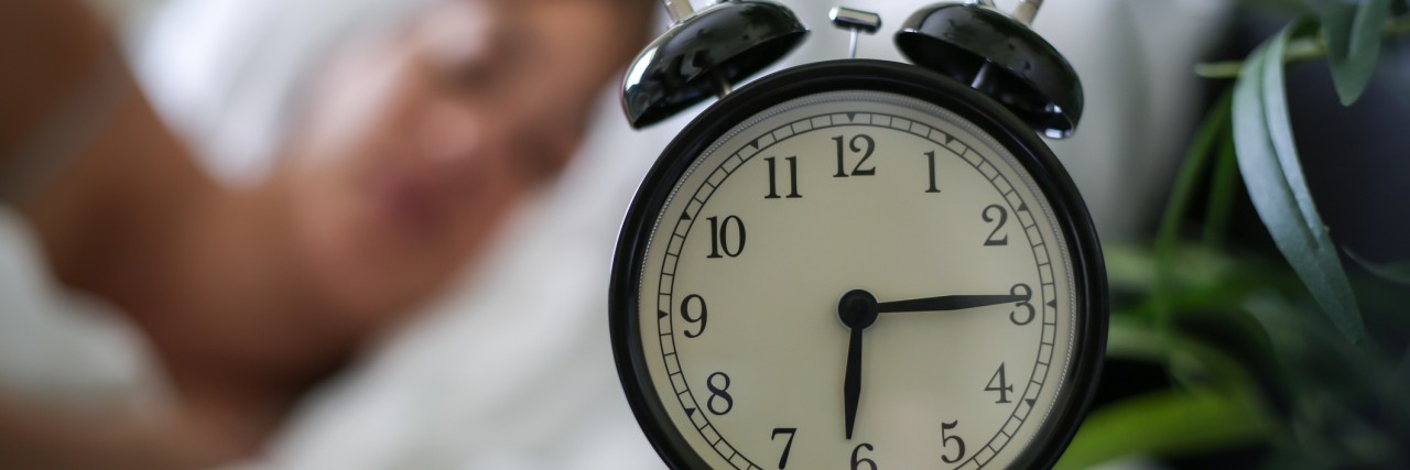 A Day in the Life of an Introvert With Depression and Anxiety Photo of a woman woman sleeping past her alarm