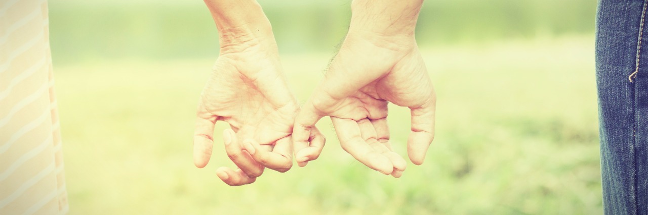 To the Spoonies Who Don't Think They Are Worthy of Love man and woman linking pinky fingers