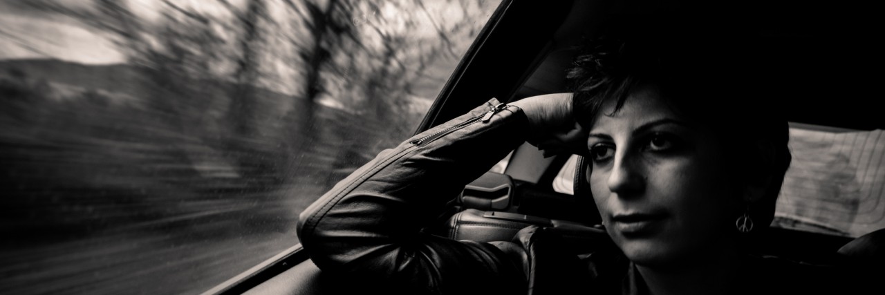 We Need to Talk About the Link Between Rape and Mental Illness Young thoughtful girl in backseat of a moving car