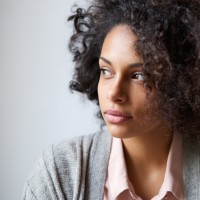 Close up portrait of a beautiful black woman looking away