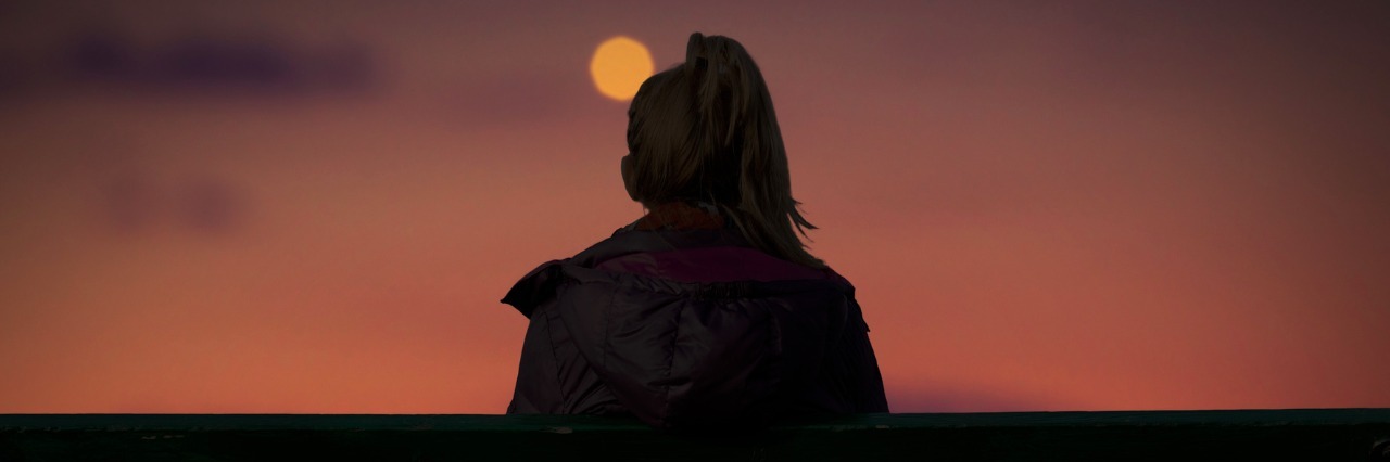 When People Have a Hard Time Understanding My Autism Silhouette of woman watching city lights at dusk