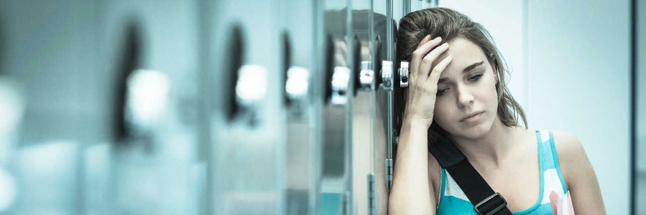 Paranoia Is More Than Just Being Nervous Wincing student having a headache