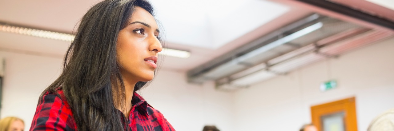 Anxiety: Why I Don't Answer in English Class student with others writing notes in classroom