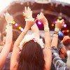 audience with hands in the air at a music festival