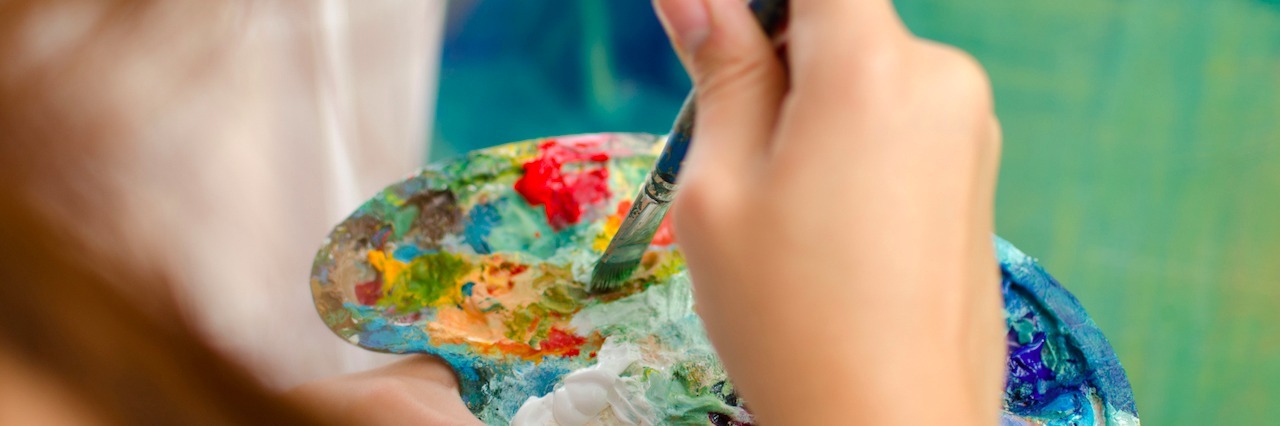 Painting Helps Me Cope With My Mental Health Difficulties woman painting a picture