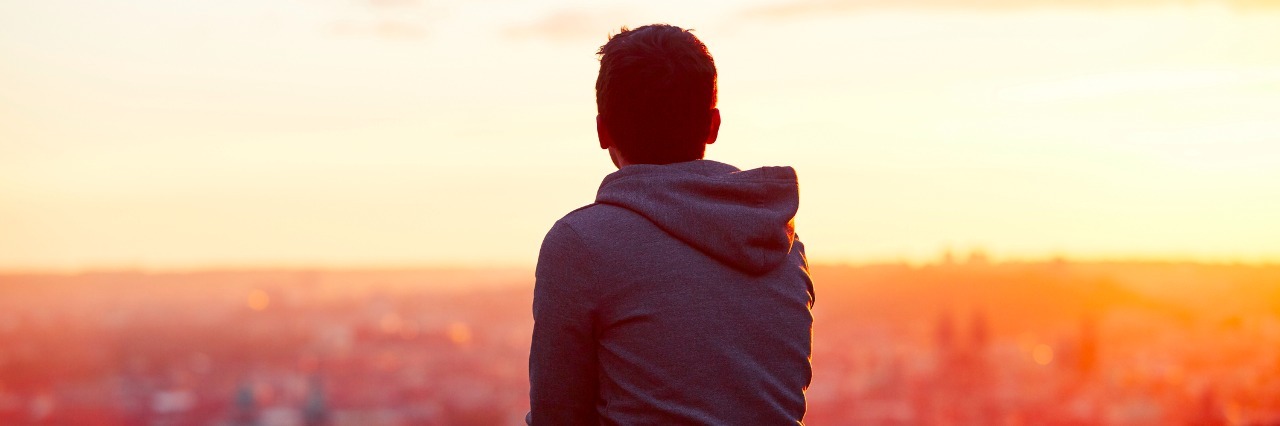 Why I'll Keep Telling You 'I'm Fine' Despite Severe Social Anxiety Man at the sunrise
