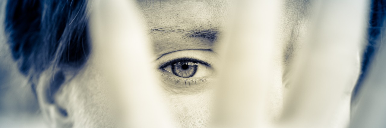 Why Hiding My Anxiety and Depression Can Be Counterproductive A woman in a very depressed mood covers his face