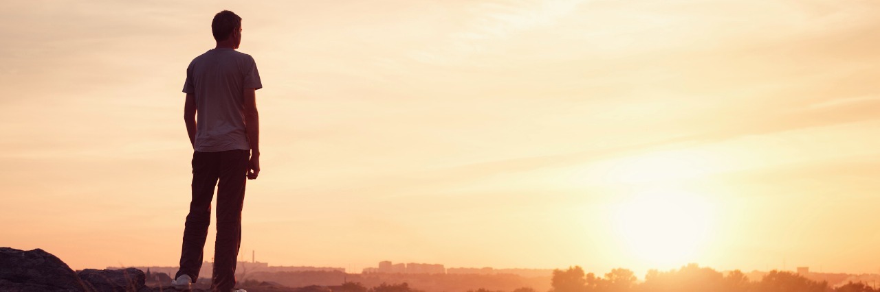 How to Be a Friend to Someone Who Has Borderline Personality Disorder silhouette of a man at the sunset on the mountain