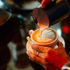 Barista making cappuccino in the coffeeshop