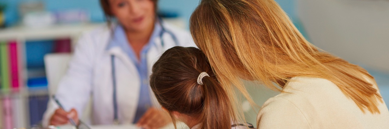 Finding Strength in Difficult Decision Making for My Sick Child mom and daughter at doctor