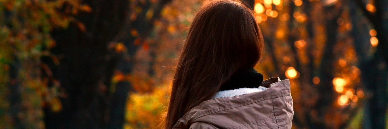 Why I Am Scared to Love With Lupus Girl in autumn park in front of sunset