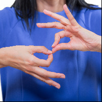 Deaf woman using sign language.