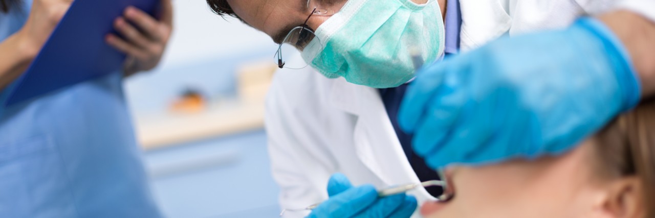 5 Tips for Dealing With Dentist Anxiety Dentist check up and repair tooth of young girl