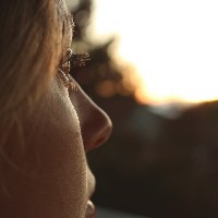 woman looking toward sunset
