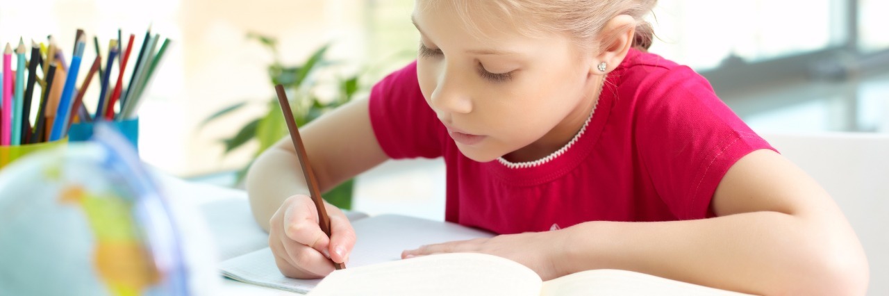 Regrets About Not Receiving ADHD and Autism Diagnoses Before Adulthood Girl studying.