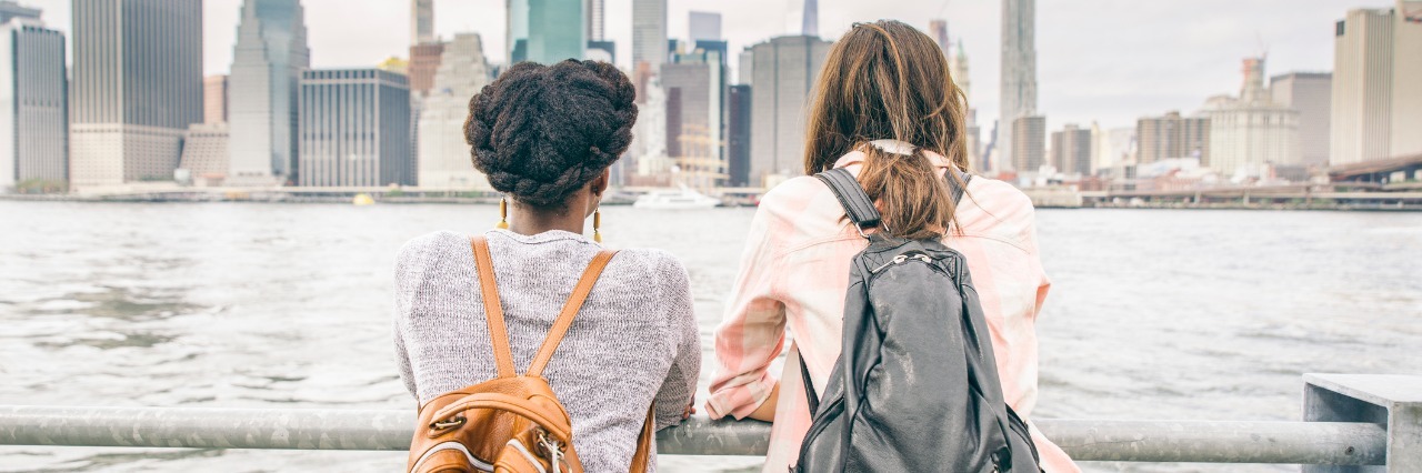 Ehlers-Danlos Syndrome: Why I Feel Guilty About Making New Friends women wearing backpacks standing on bridge looking at skyline