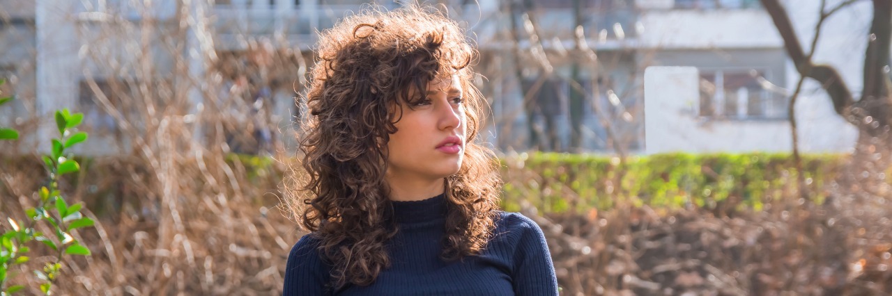 A Year After My Suicide Attempt: What I Know Now girl sitting on a bench