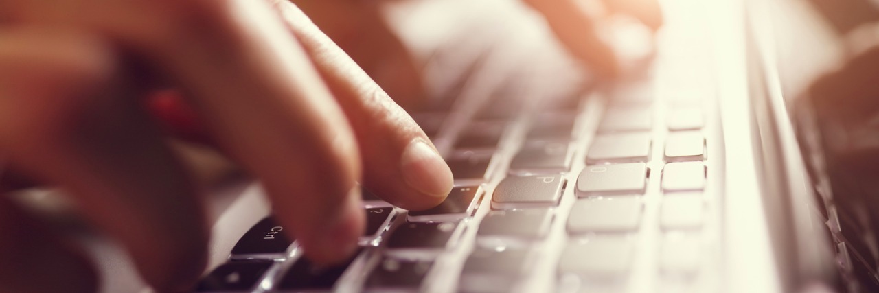 What I’ve Learned From Becoming a Chronic Illness Advocate Hands typing on laptop computer