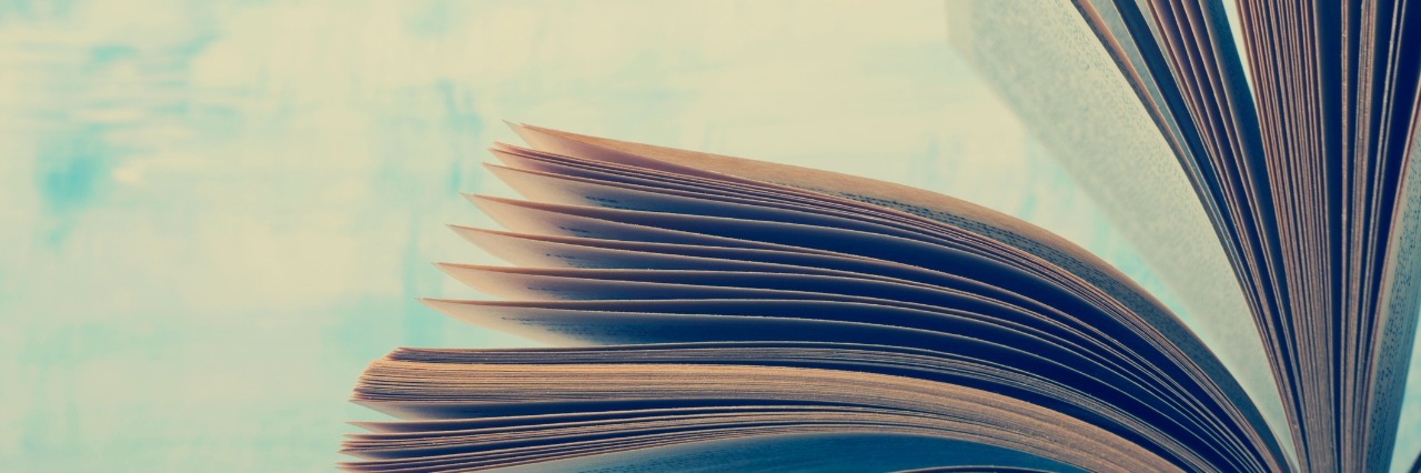 How Literature Can Help You Cope With Feelings of Depression pages of an open book against a sky background