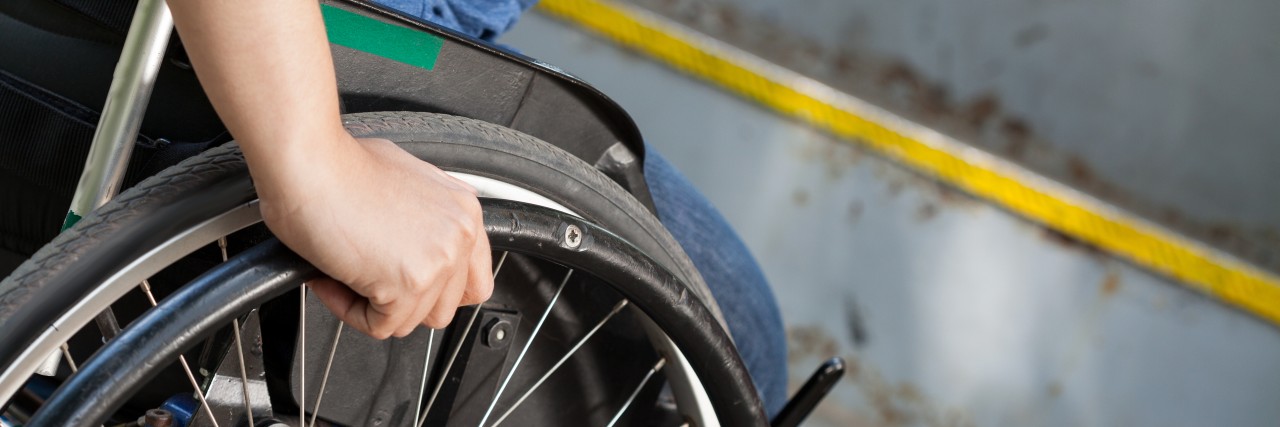 Don't Touch Someone's Wheelchair Without Permission Wheelchair user trying to board a bus.