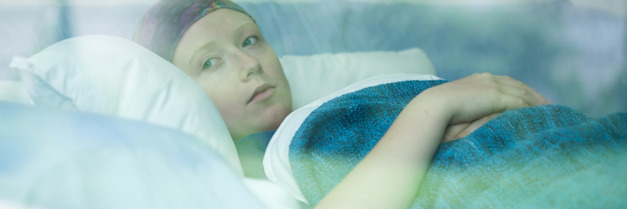 Young woman in hospital bed
