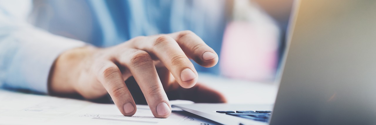 What Happens When You Post About Depression and Anxiety on Facebook man on a computer