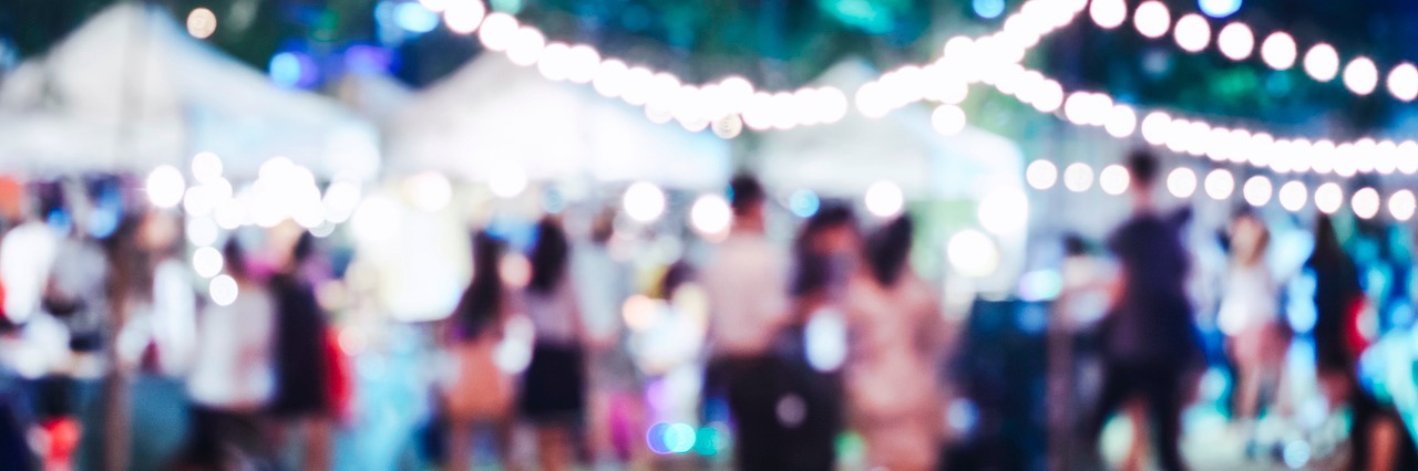 What It's Like to Have Social Anxiety Before a Party a blurry outside party scene