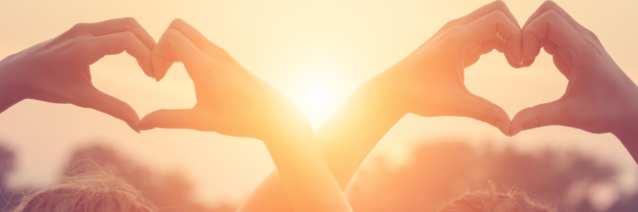 Letter of Encouragement to a Friend With Depression friends making heart shapes with hands