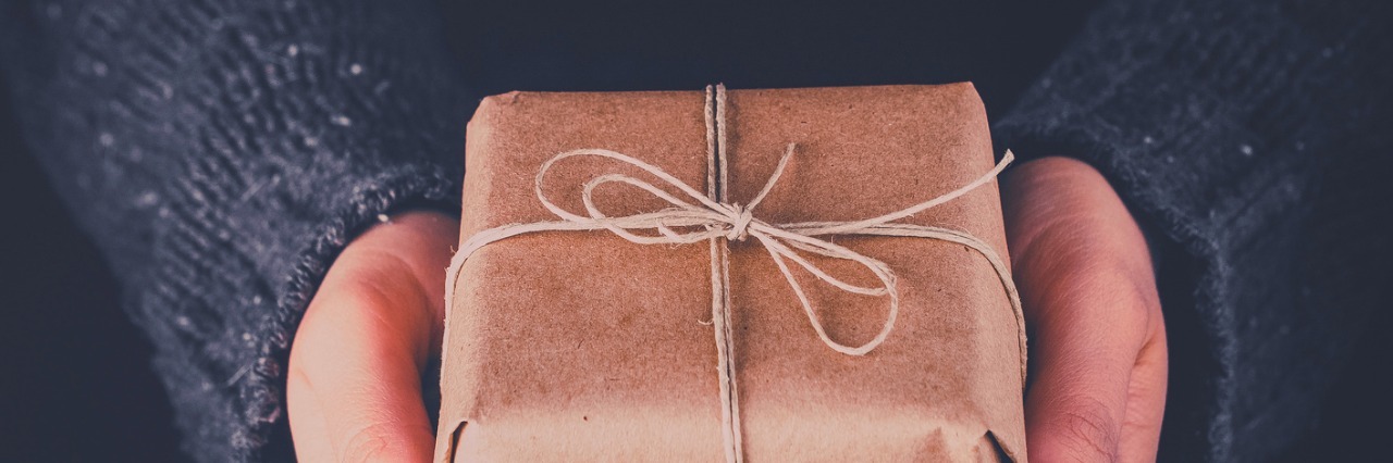 Everyone Needs a Self-Care Box Woman hands holding gift