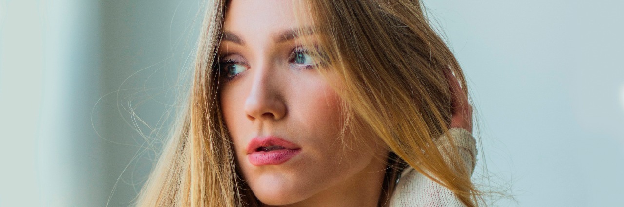 When I Realized My Eating Disorder Didn't Have Control of My Life Young blonde woman sitting next to window