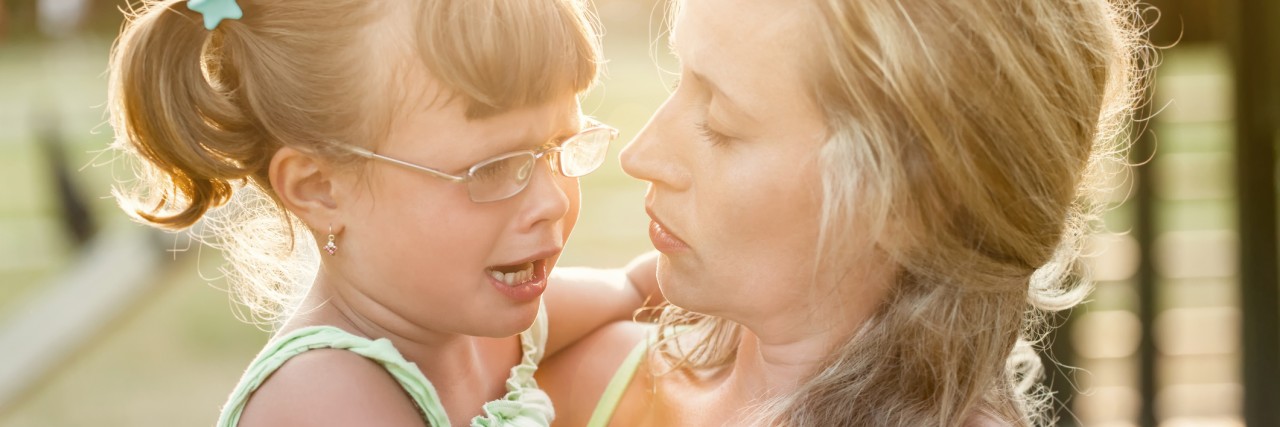 Parenting With PTSD When My Child Has Separation Anxiety Mother comforts crying daughter outdoors ,