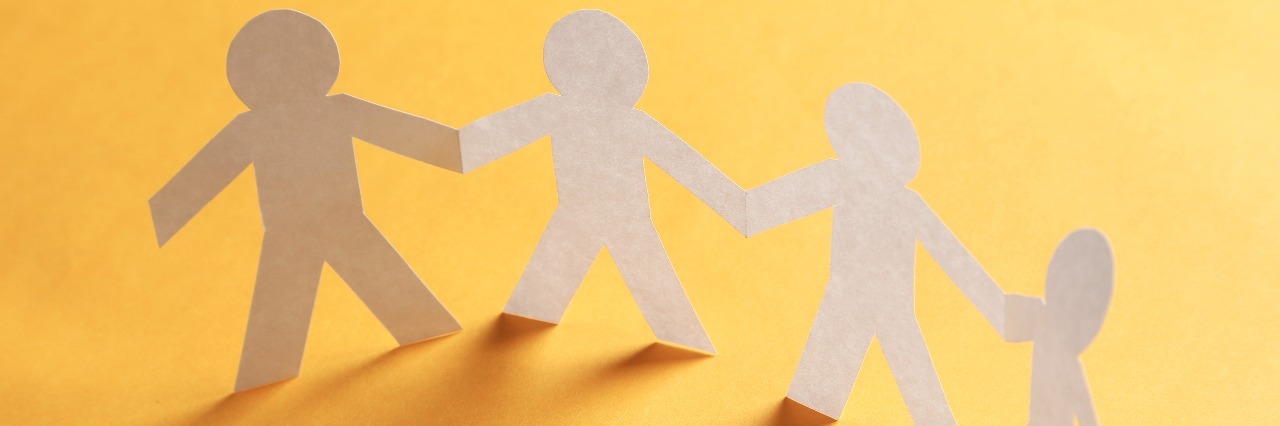 Tips for Supporting a Friend Who Has OCD and Self-Harms Paper people on the orange paper background