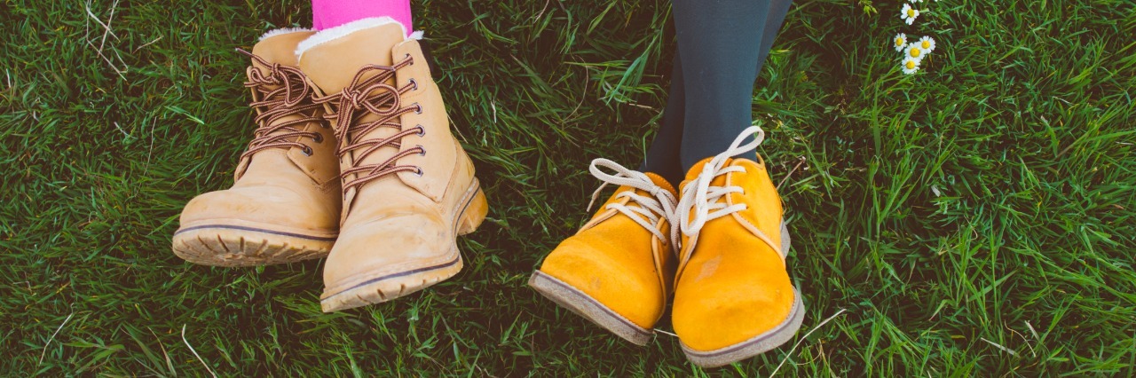 To the Friend Who Supported Me Through My Eating Disorder Two woman laying in the ground with colored leggings and boots