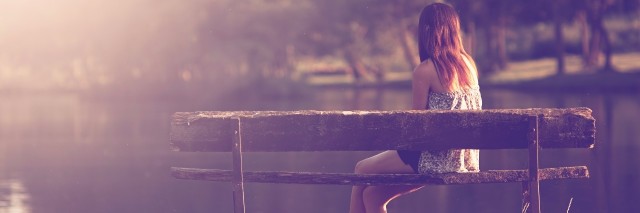 Girl sitting on a bench