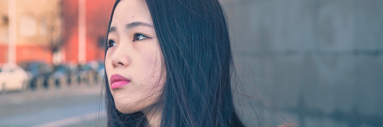 What to Say to Someone Who Thinks You Cut for 'Attention' A woman looking sad