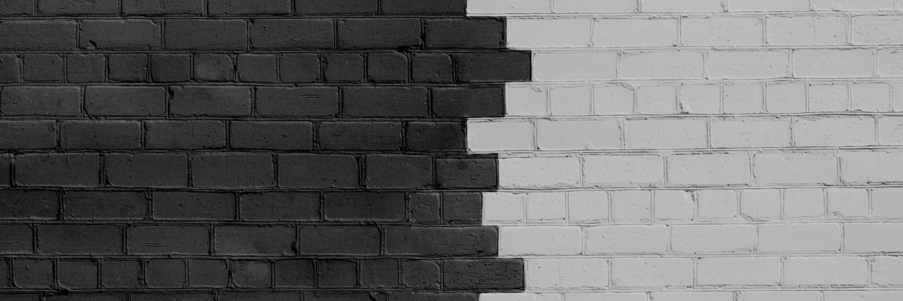 Post-Traumatic Stress Disorder Makes It Hard to Let People In Brick Wall Parted on Dark and Light Sides