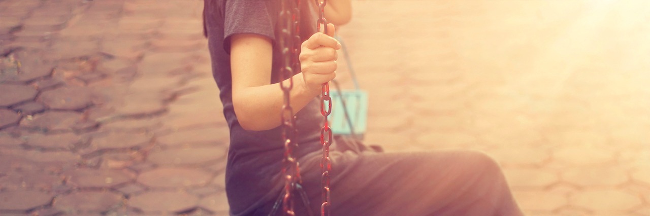 What Happens When Friends Leave When You're Depressed woman sitting on the swings below
