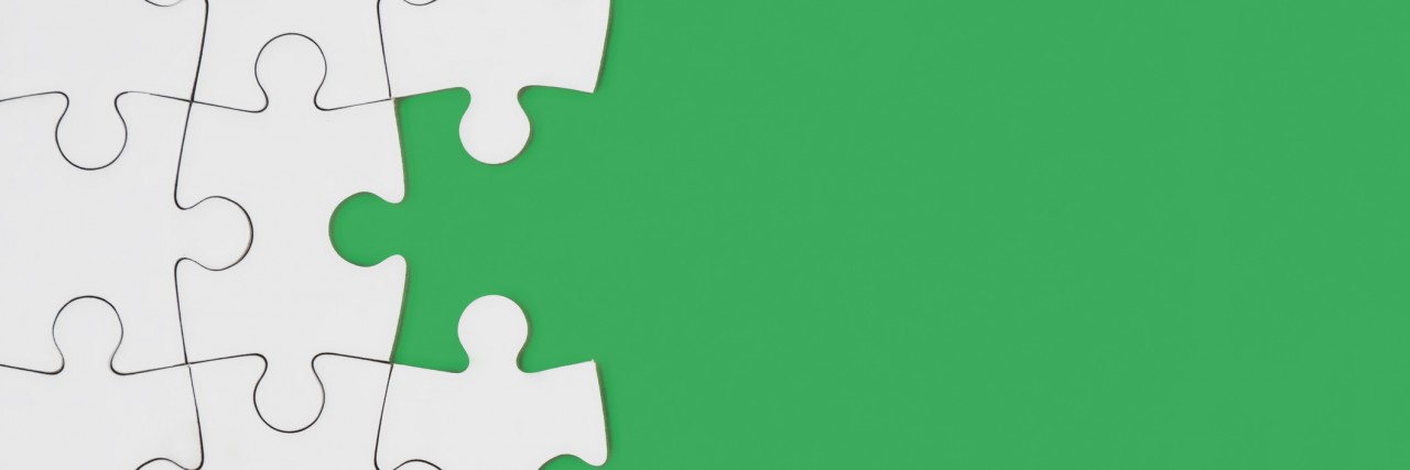A puzzle in green background