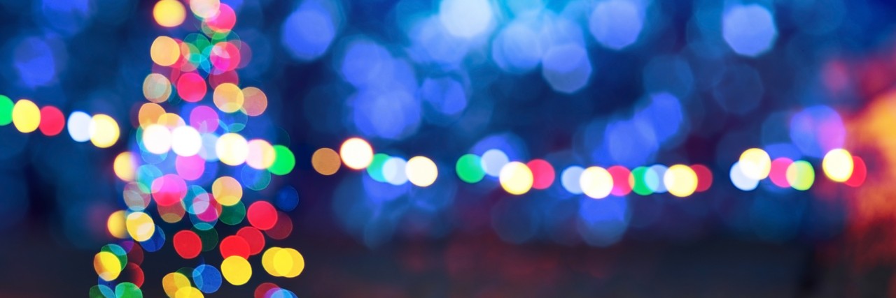 Depression and Looking for the Light blue background with Christmas tree