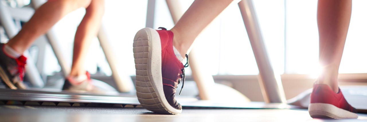 What Fitness Instructors Should Know About Those With Surgery, Illness Legs of sportswoman during training on treadmill