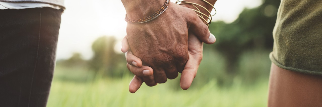 Supporting a Partner With Borderline Personality Disorder two people holding hands
