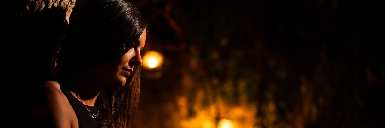 Woman in a Garden at Night