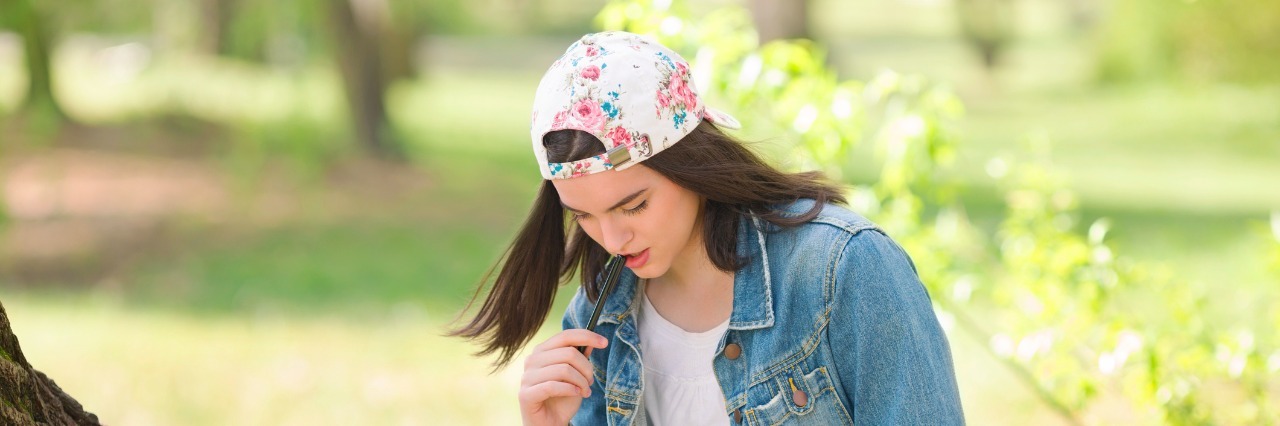 Dear Mom & Dad: A Letter From Your Child in Eating Disorder Recovery Girl Studying Outdoors