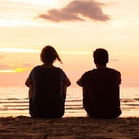photo of two people under the text [16 things people on the autism spectrum want their loved ones to know]