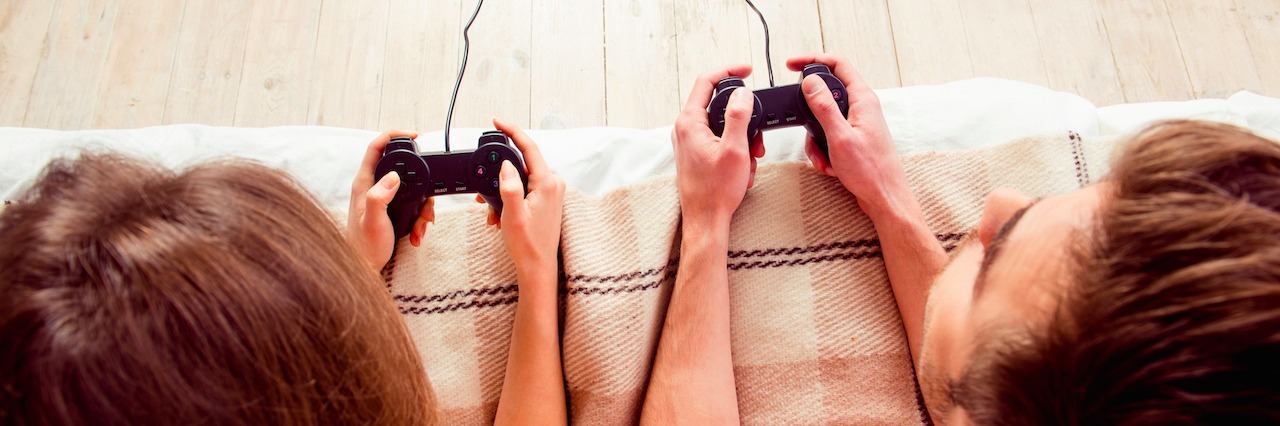 New Year's Resolutions for Gamers With Anxiety and Depression A man and a woman playing video games