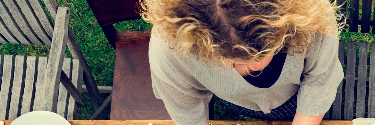 Why I Don't Want You to Ask How I'm Feeling at Dinner Woman Preparing Table Dinner Concept