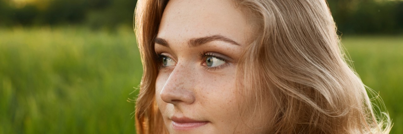 The Gaslighting of Chronic Lyme Patients Has to Stop Close-up image of a beutiful girl isolated over green background