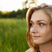 Close-up image of a beutiful girl isolated over green background