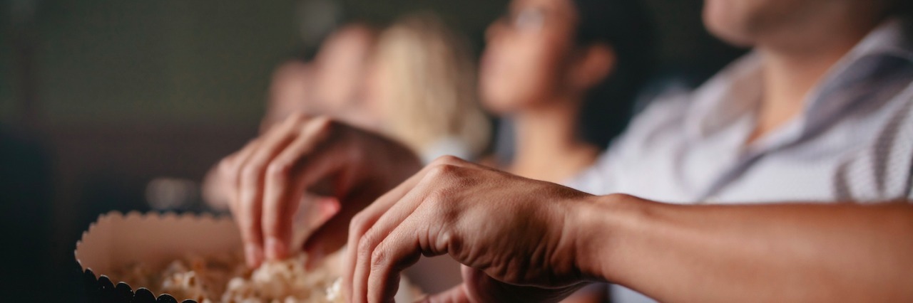 Tourette Syndrome: Kindness Overcoming Ignorance at Movie Theater People eating popcorn in movie theater